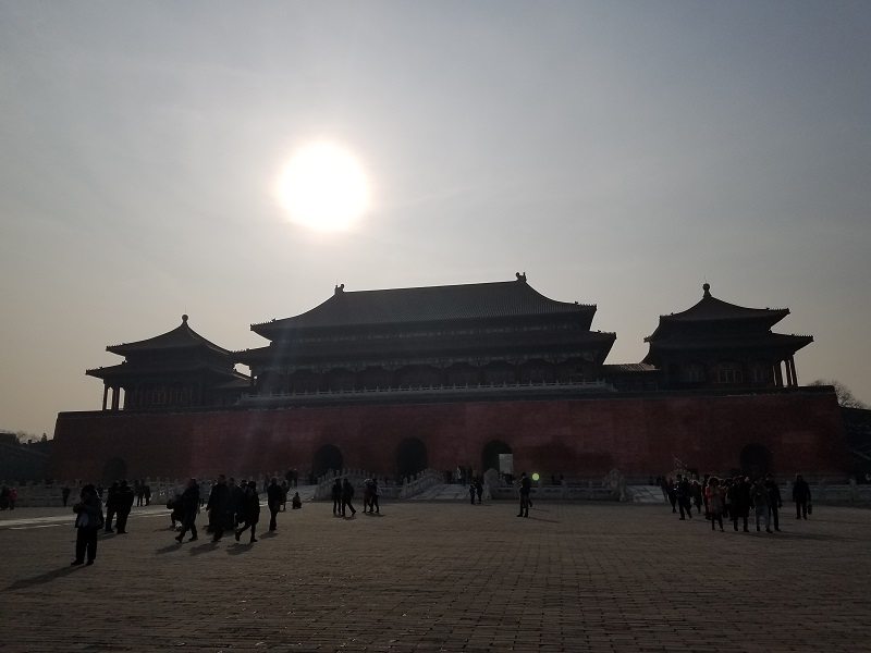Smog obscures the mostly sunny sky somewhat over Beijing's historic Forbidden City. Photo: Weatherboy