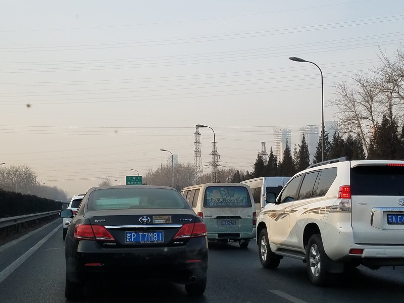 Traffic is backed up on one of the ring roadways that surrounds the city of Beijing. The last digit of a vehicle's license plate corresponds to a day of the week that Beijing drivers are not allowed on the roads in an effort to reduce pollution. Photo: Weatherboy