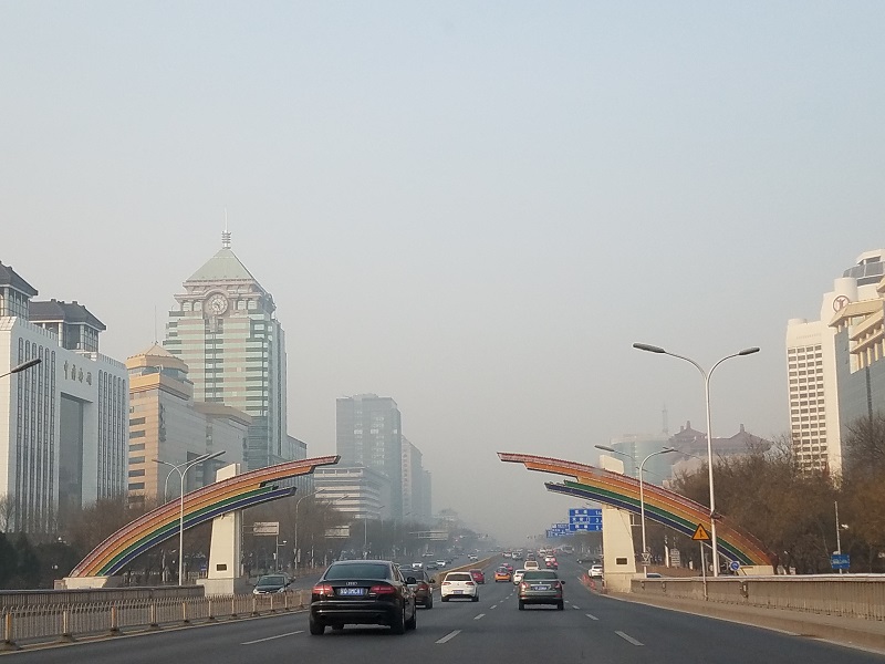 Despite bans designed to reduce the number of cars and trucks on city highways, roadways in Beijing remain busy despite the high pollution alerts. Photo: Weatherboy