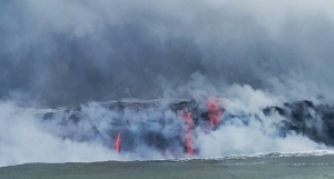 Lava enters the ocean on the east coast of Hawaii, setting off a series of explosions that blast rocks into the air, water, and land while setting-the stage for a plume of steam and hydrochloric acid. Photograph: Weatherboy