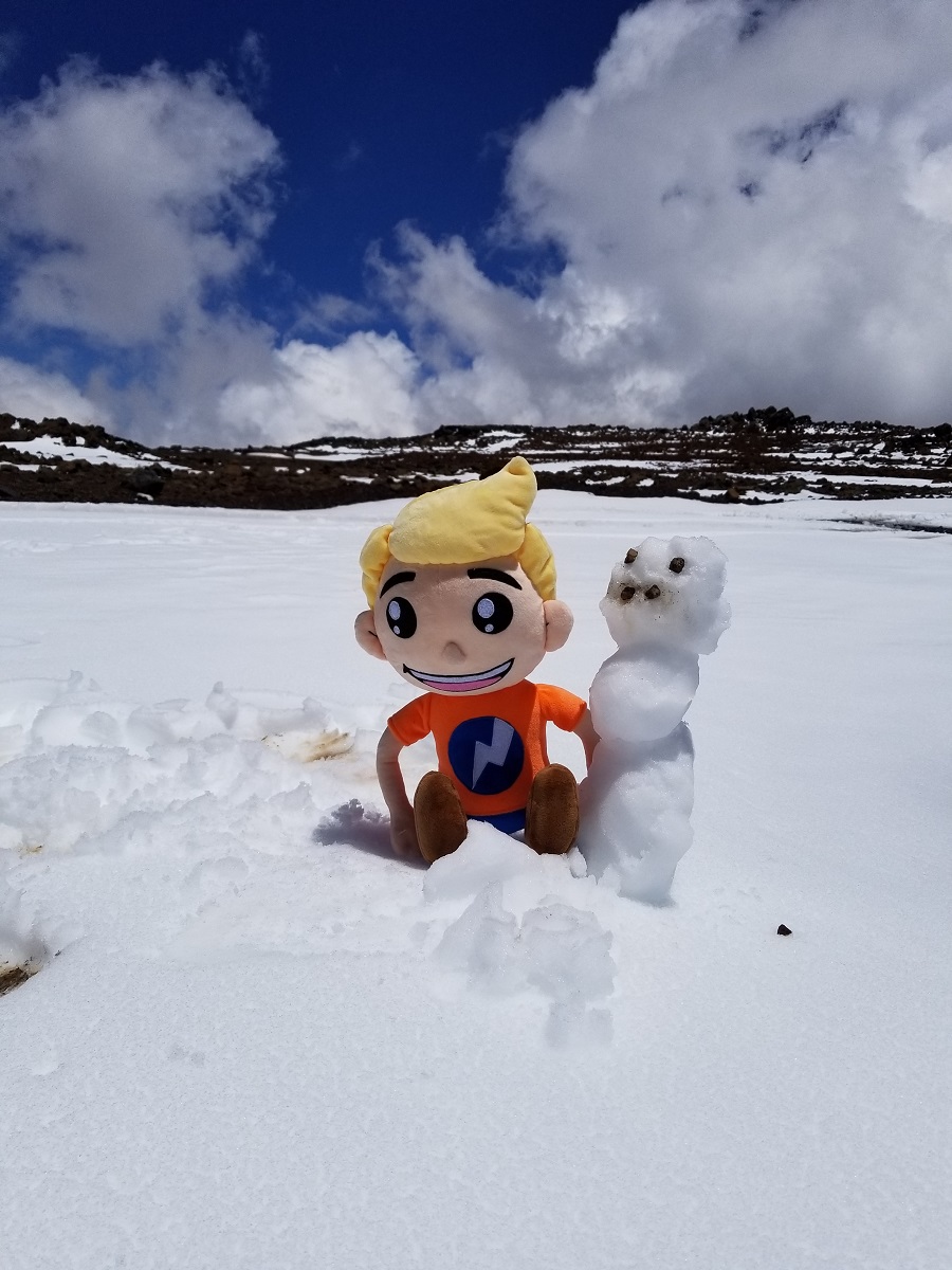Time for fun in the snow! Weatherboy makes a snowman in the snow on top of Mauna Kea after a late season snowstorm brought heavy snow to Hawaii in May.  Photograph:  Weatherboy