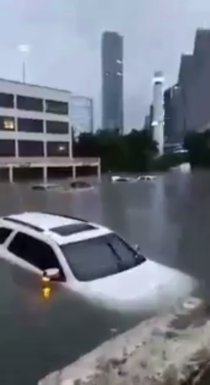 Personal cars and patrol cars from the Houston Police Department float around in the submerged city of Houston. Photograph: Houston Police Officer's Union