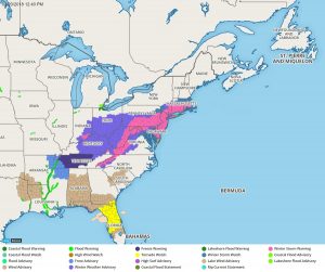 The National Weather Service has issued Winter Storm Warnings (bright pink) for this winter storm; they've also issued a Tornado Watch (yellow) for severe thunderstorms on the southern side of this storm. Image: Weatherboy.com