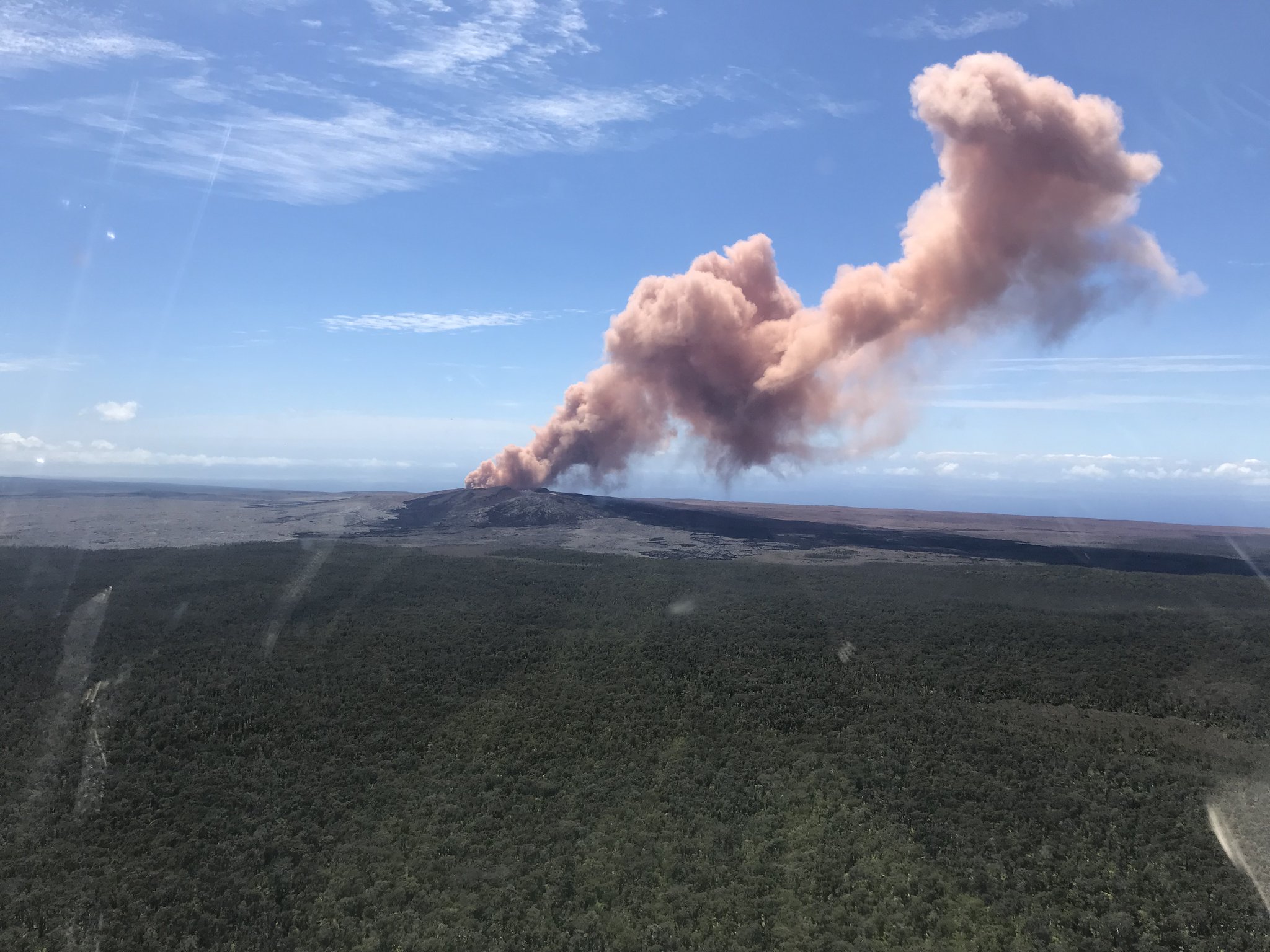 A plume of ash rises from Kilauea after a strong 5.0 quake struck the area this morning. Image: USGS photo by Kevan Kamibayashi.