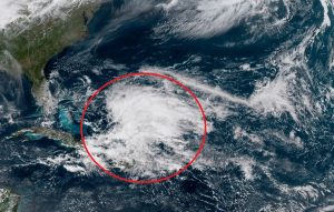 GOES-East satellite image shows a disturbance in the red circled area near the Bahamas. The US southeast coast is in the upper left corner of this map. Image: NOAA