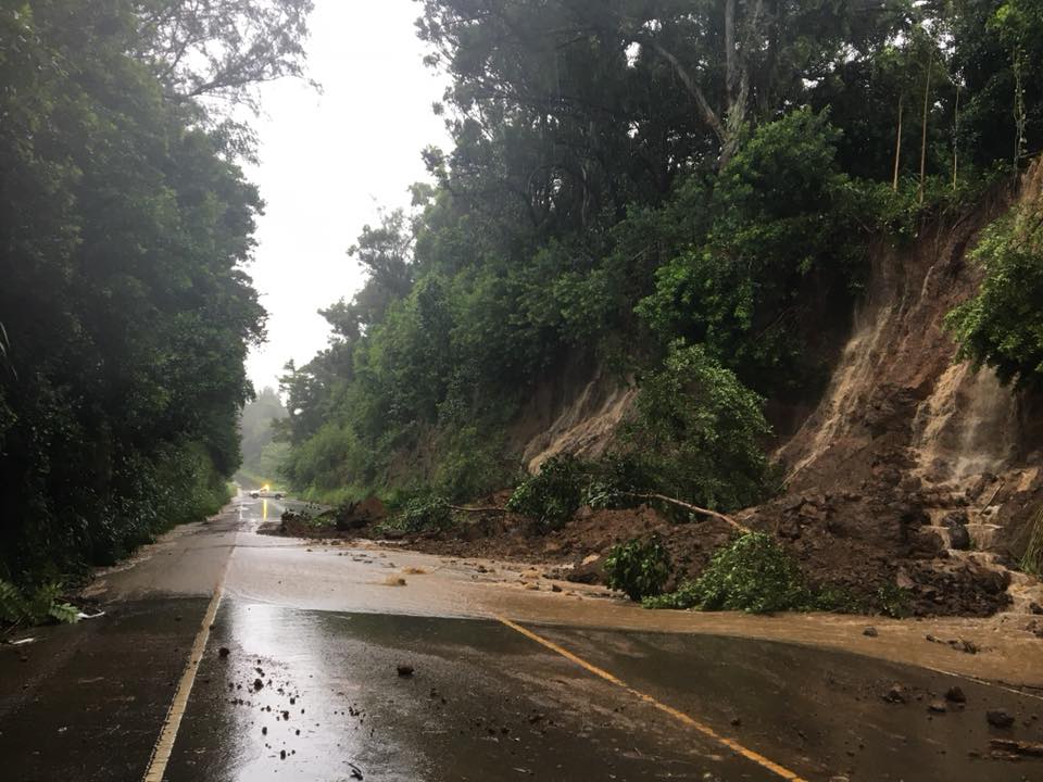 Numerous landslides have swept mud, debris, and trees onto highways on Hawaii and Maui. This is the scene on Akoni Pule Highway in Hawi, Hawaii. Image: Hawaii Department of Transportation