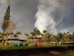 Volcanic fumes rise from a fissure inside Leilani Estates behind a since-abandoned playground that now sits inside a mandatory evacuation zone. Photograph: Weatherboy