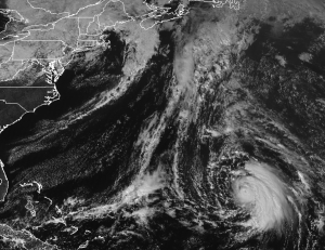 A black & white photograph from the GOES-East weather satellite shows Hurricane Oscar's well defined structure over the Atlantic. Image: NOAA