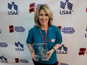 Leslie Chapman-Henderson shows the William Gray Award she won at the 2019 National Tropical Weather Conference. Image: Weatherboy