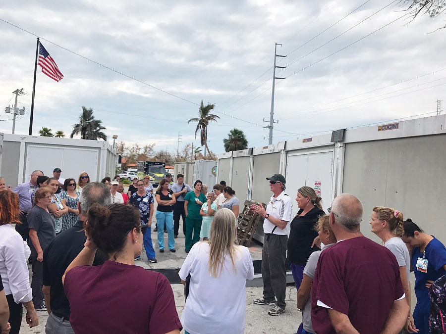 Rick Freeburg, Fisherman’s CEO. stands with employees following Irma before they open the Field Hospital in the parking lot of the original building which could no longer be used. Image: Baptist Health