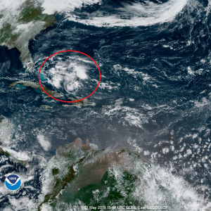 The disturbance being tracked by the National Hurricane Center is circled in red in this GOES-East weather satellite view. Image: NOAA