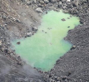  was taken on August 18, 2019. The water level continues to slowly rise in Halema‘uma‘u, drowning many of the small rocks that were previously exposed in the center of the pond. The color of the water ranged from semi-translucent blue to opaque green-yellow in the western part of the pond. Image: Matthew. Patrick / USGS