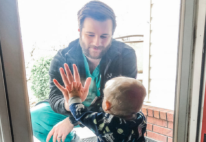 Dr. Burks says goodbye to his son Zeke outside of his home, unable to interact with his son and wife due to fears of COVID-19. Image: Alyssa Burks