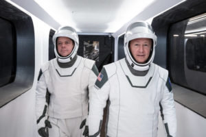 NASA astronauts Bob Behnken, left, and Doug Hurley, wearing SpaceX spacesuits, walk through the Crew Access Arm connecting the launch tower to the SpaceX Crew Dragon spacecraft during a dress rehearsal at NASA’s Kennedy Space Center in Florida on January 17, 2020. Image: SpaceX
