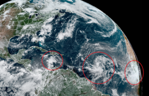 The three areas circled in red on the latest GOES-East weather satellite view show the disturbances being monitored by the National Hurricane Center for tropical cyclone development. Image: NOAA