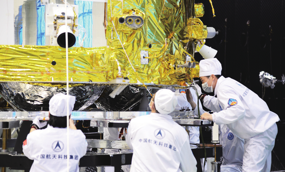 Change'e 5's orbiter-return capsule assembly is being examined by program scientists in China. Image: SHI Xiaodan / Aerospace China