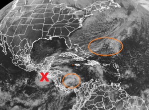 The latest GOES-East weather satellite view shows the remnants of Iota at the "X" and two circled areas of concern in the Atlantic basin.  Image: NOAA
