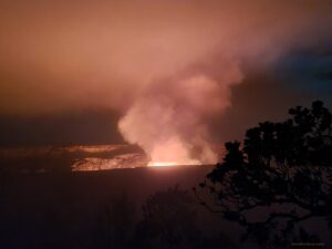 Lava erupting from the Kilauea volcano illuminates not only the crater at night, but the tower of gas leaving the eruption site too. Image: Weatherboy