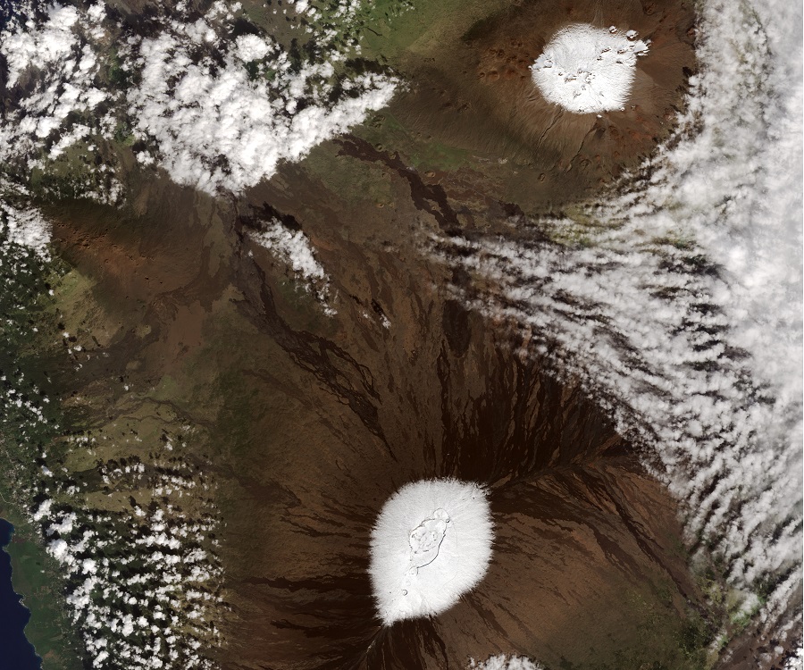 High resolution satellite photography shows Big Island Summits Mauna Kea, top, and Mauna Loa, bottom, covered in snow. Image: NASA