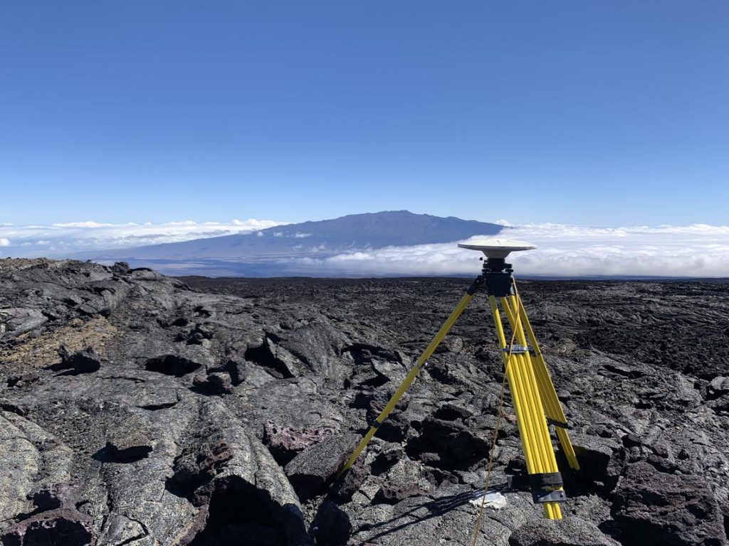 In 2020, HVO geophysicists conducted an annual high-precision Global Positioning System (GPS) survey of Mauna Loa, which supplements HVO's continuous GPS monitoring stations. The annual GPS surveys provide information on vertical and horizontal deformation, informing HVO about the volume changes within subsurface magma res rvoirs at Mauna Loa. This station was located on the north flank of Mauna Loa, with Mauna Kea (hugged by clouds on its east side) visible in the background. Image: USGS / S. Conway.