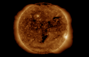 A solar wind sourced from the middle, darker parts of this enhanced view of the Sun from the GOES-16 weather satellite is heading to Earth this weekend. Image: NOAA / SWPC
