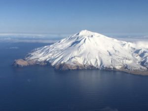 View of the Great Sitkin volcano from the departing Adak to Anchorage flight on March 11, 2020. Image: Ed Fischer / USGS-AVO