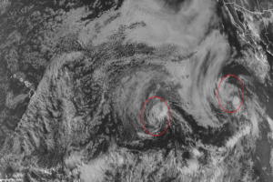Hurricane Felica, the left circle, and Tropical Storm Guillermo, right circle, march west across the Pacific Ocean. Felicia is roughly 1,500 miles east of Hilo, Hawaii. Image: NOAA