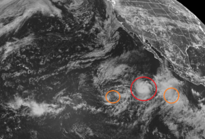 Hilda, circled in red, will likely become a hurricane soon. Tropical Depression 9E, the orange circle to the left, is expected to strengthen into a tropical storm. The orange circle on the right is likely to become the basin's newest tropical cyclone. Image: NOAA