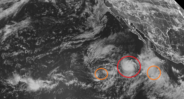 Hilda, circled in red, will likely become a hurricane soon. Tropical Depression 9E, the orange circle to the left, is expected to strengthen into a tropical storm. The orange circle on the right is likely to become the basin's newest tropical cyclone. Image: NOAA