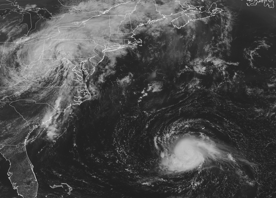 A black & white image from the GOES-East Weather Satellite shows the remnants of Fred moving through the northeastern U.S. while Henri spins about over the Atlantic Ocean. Image: NOAA
