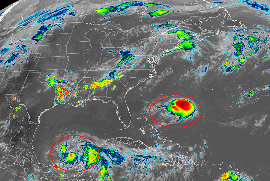 Tropical Storm Grace, left, and Tropical Storm Henri, right, continue to spin about within the Atlantic Hurricane Basin, as this current GOES-East weather satellite view shows. Image: NOAA