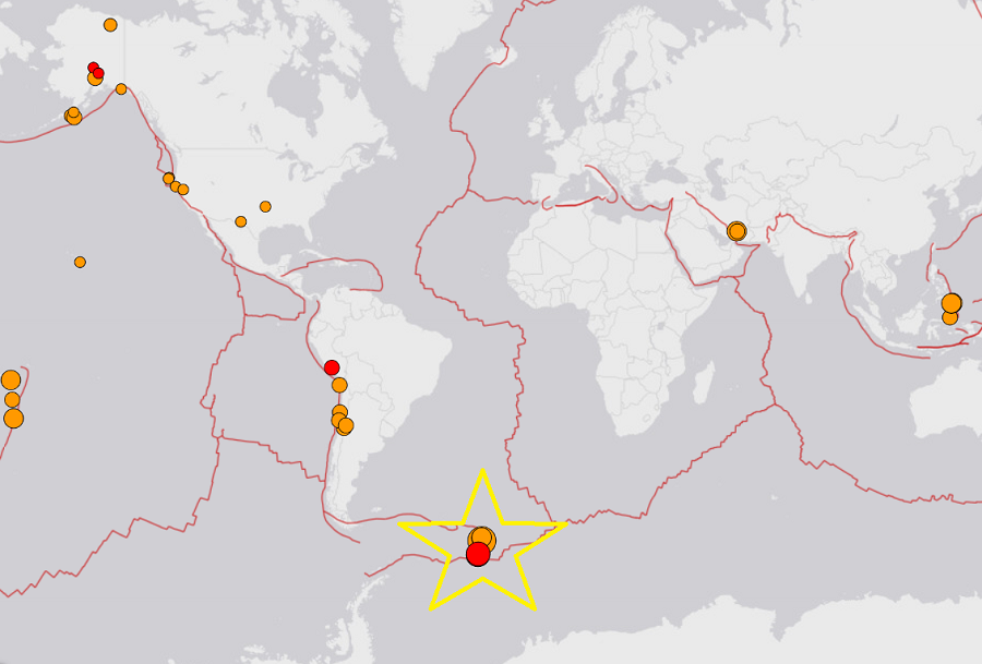 Orange dots reflect recent earthquakes around the world, with the red dots reflecting the most recent quakes. The star illustrates the area rocked by today's massive quake in the Atlantic.  Image; USGS