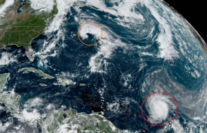 Hurricane Sam, red, and a new system, orange, are expected to intensify today. Image: NOAA