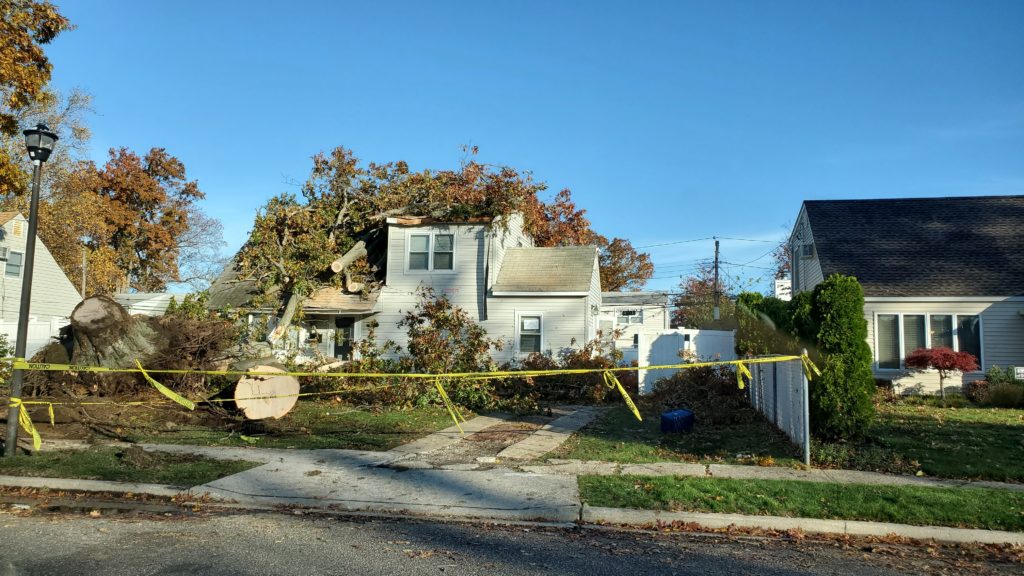 This home in Levittown, New York was damaged in Saturday's tornado touch-down. Image: NWS