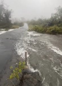 Many roads flooded throughout Hawaii, including this road in Hawaii Volcanoes National Park which resembles more of a river than a roadway. Image: Hawaii Volcanoes National Park