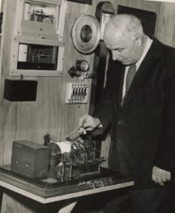Weather observer William D. Martin Jr. reviews equipment at the Long Branch weather station in 1960. Image: NWS