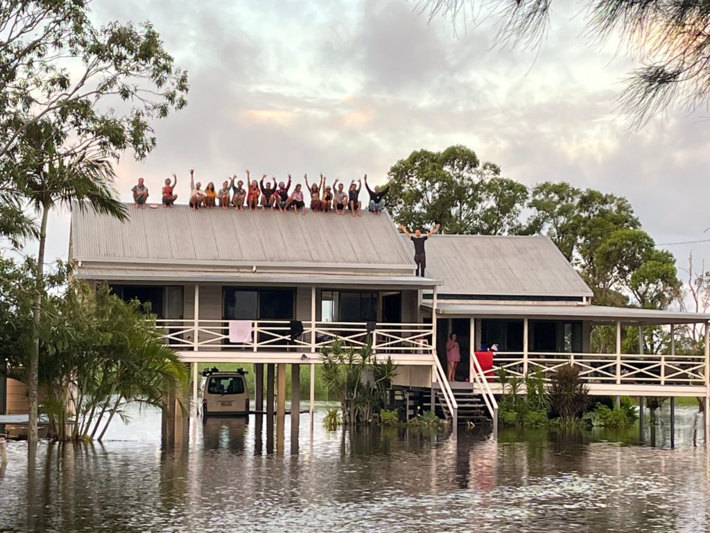 A family is waiting to be evacuated from rising flood waters on top of the roof of their home in Queensland, Australia where flood waters continue to rise due to a "Rain Bomb." Image: Queensland Fire & Emergency Services