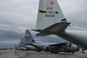The 53rd Weather Reconnaissance Squadron has returned to its vintage paint scheme and the 'Weather' markings on the tail flash. The first of ten WC-130J Super Hercules returned after getting the new glossy paint and sits next to the tactical gray painted version at Keesler Air Force Base, Mississippi, on April 5. Image: U.S. Air Force / Senior Master Sgt. Jessica Kendziorek