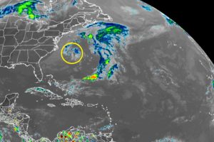 A weather system drifting off of the U.S. East Coast continues to be monitored for signs of development. New data out this afternoon makes development less likely around the system circled in yellow on this latest GOES weather satellite view. Image: NOAA