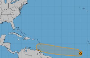The National Hurricane Center believes there's a good chance that a tropical disturbance marked by the X will move west and become a tropical cyclone somewhere in the orange shaded area over the next five days. Image: NHC