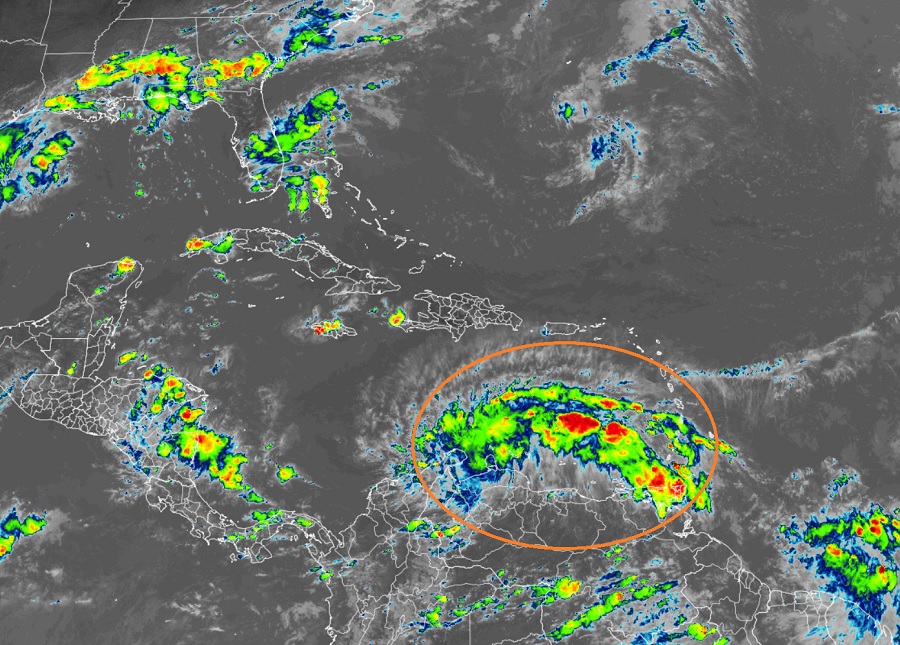 The National Hurricane Center says the elongated area of showers and storms could develop into a tropical cyclone at any time. Image: NOAA