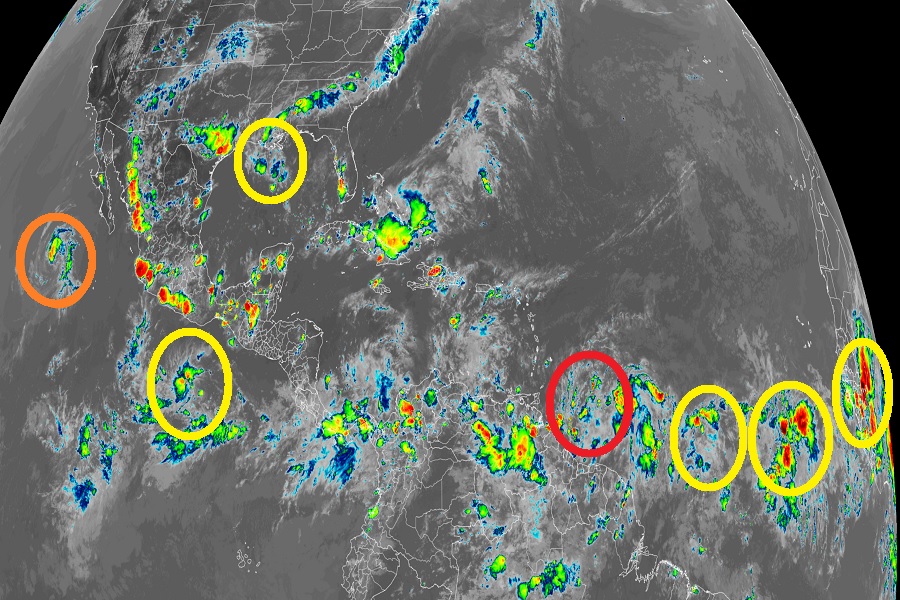 There are many areas of disturbed area that could become a tropical threat in the coming days; the orange circle in the Eastern Pacific Hurricane Basin is Tropical Storm Celia while the red circle in the Atlantic Hurricane Basin is what is expected to become Hurricane Bonnie. The other yellow areas could develop over the next 5-10 days too. Image: NOAA