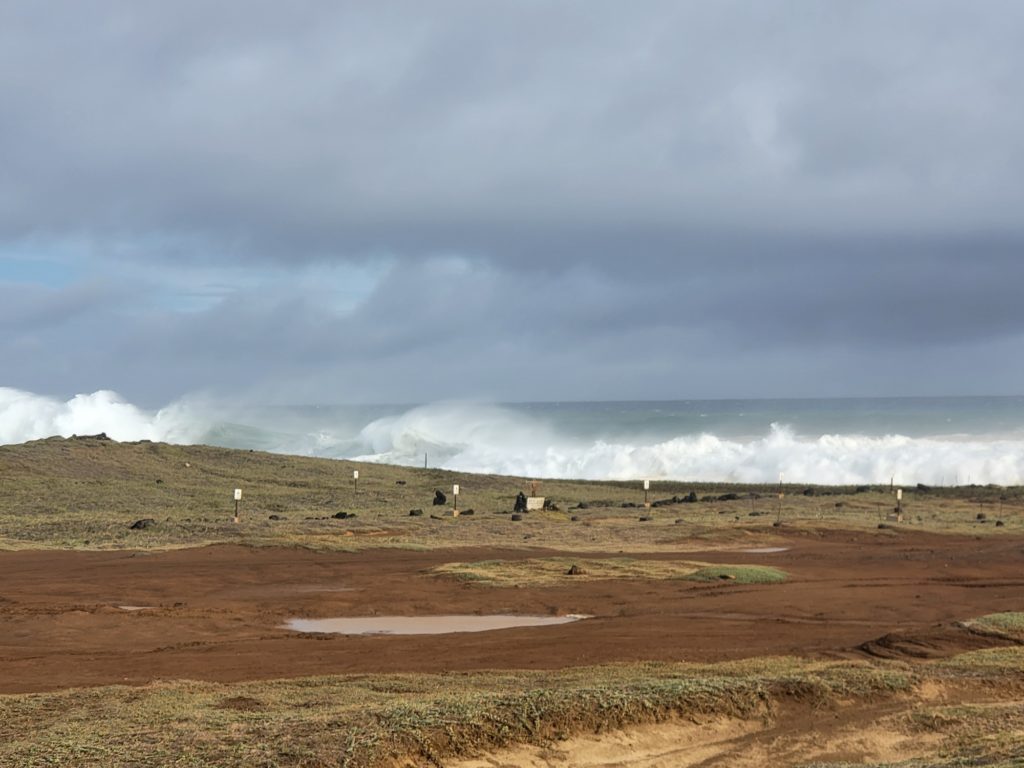 A cultutrally significant and historic site near South Point is eroded away by the historic swell event in Hawaii on Saturday. Image: Weatherboy