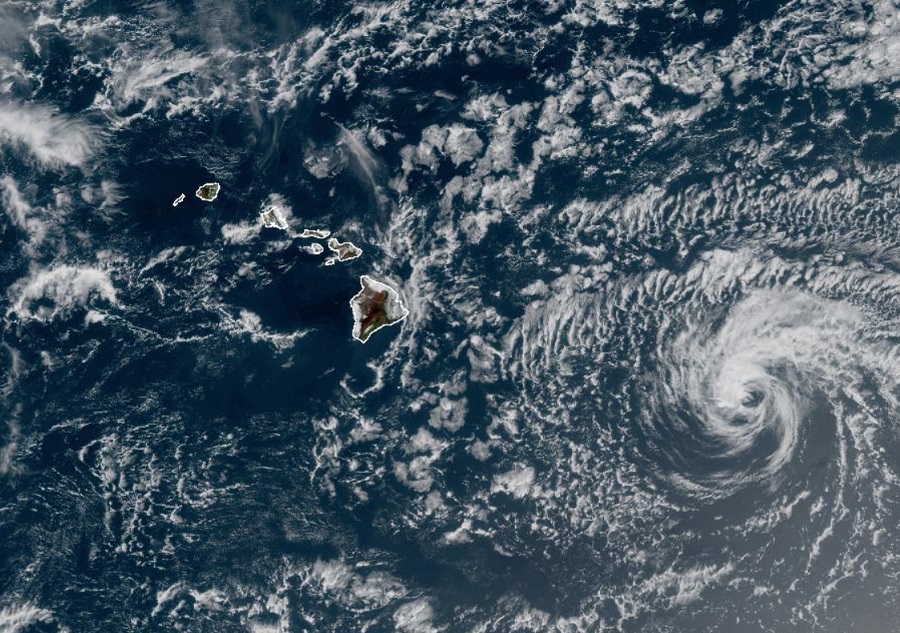Tropical Storm Darby appears as a swirl of clouds with limited convective activity to the east of the Hawaiian Islands. Image: NOAA