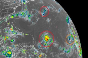 The National Hurricane Center are tracking the three circled areas of disturbed weather in the Atlantic for potential cyclone development. The two red circle ones are expected to develop into a tropical cyclone within the next 5 days. Image: NOAA