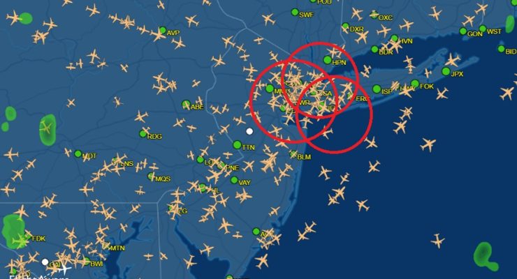 This is the current air travel map produced by FlightAware, reflecting the location of every airplane in the region. Newark Liberty, La Guardia, and John F. Kennedy Airports are circled in red. Image: FlightAware