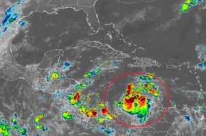 Tropical Depression #13, circled in red, is forecast to become a tropical storm today and perhaps a hurricane by Sunday morning as it moves through the southern Caribbean. Image: NOAA