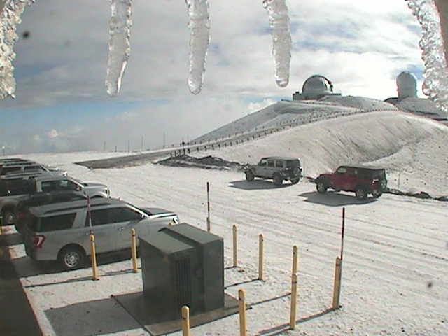 A webcam view of the summit of Mauna Kea shows a wintry scene: snow and icicles as temperatures and wind chill factors drop to frigid levels. Image: W.M. Keck Observatory Webcam