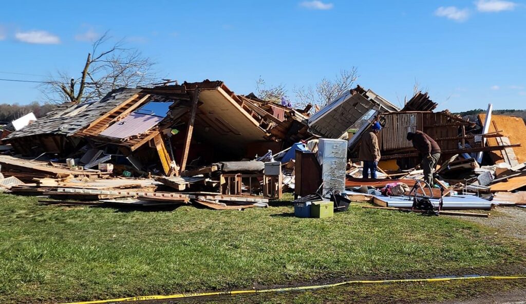 People sift through a destroyed house in the aftermath of a tornado that struck Sussex County, Delaware on April 1. Image: Delaware Emergency Management Agency