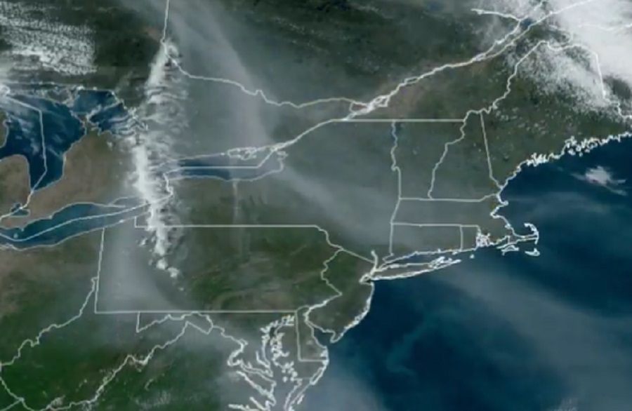 Hazy streams of smoke could be seen on weather satellite photographs today originating from fires in Alberta, Canada. Image: NOAA